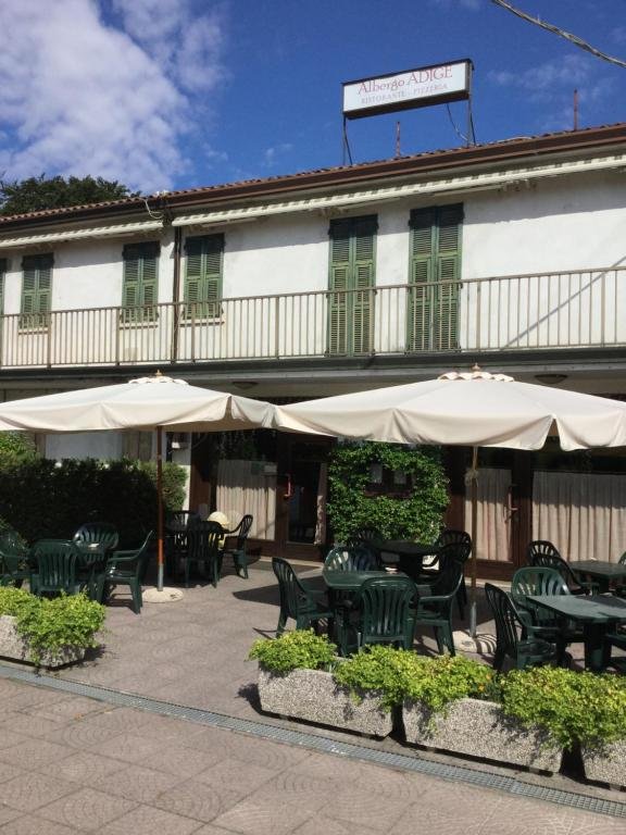 Albergo Adige exterior with garden terrace